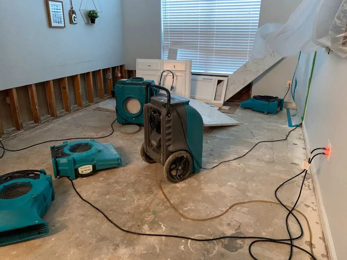 Dehumidifier in flood-cut room for Water Damage Restoration in Moore